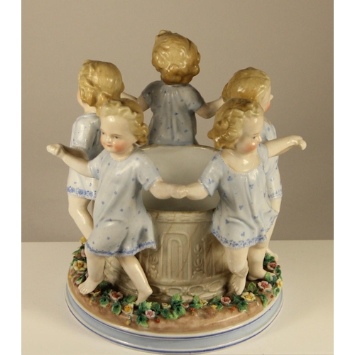 177 - An Ernst Bohne and Sohne porcelain figure of girls skipping around a well, stamped to base, 18 x 16 ... 