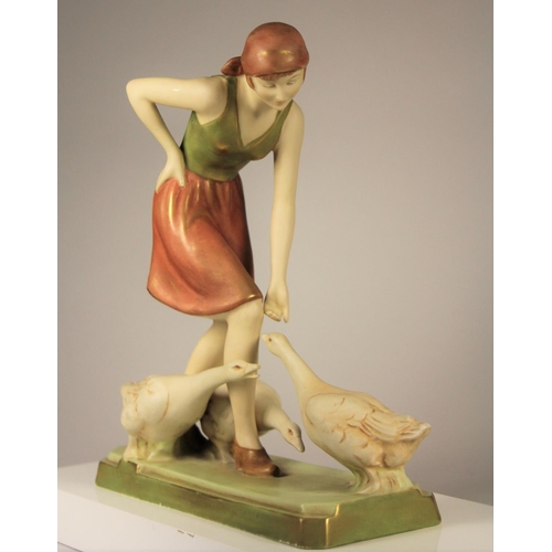 178 - A Royal Dux figure of a woman feeding geese, pink triangle mark and stamped 3287 to base, 27 x 23 cm