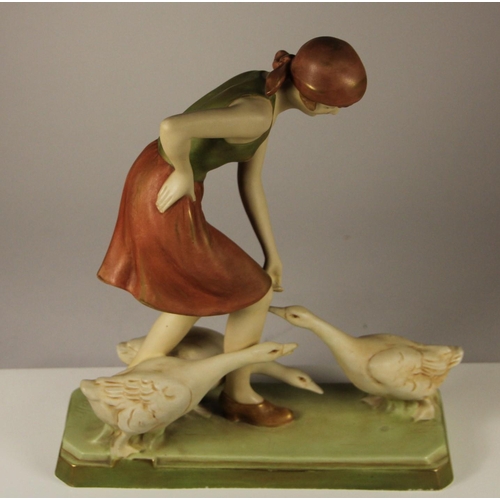 178 - A Royal Dux figure of a woman feeding geese, pink triangle mark and stamped 3287 to base, 27 x 23 cm