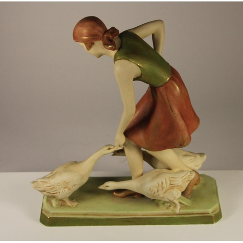 178 - A Royal Dux figure of a woman feeding geese, pink triangle mark and stamped 3287 to base, 27 x 23 cm