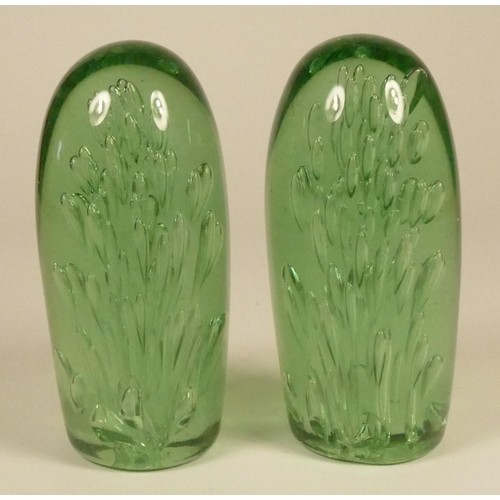 184 - Two Victorian green glass dumps, with bubble decoration, 15 cm