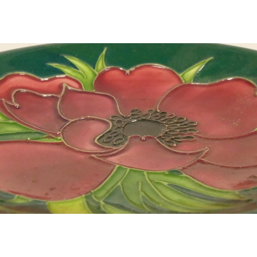 188 - A Moorcroft plate, cobalt blue and green glaze, with red poppy flower detail, signed and dated 2002 ... 