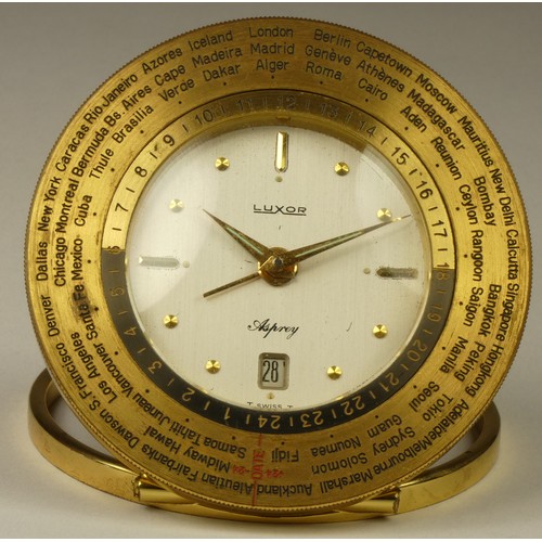 207 - An Asprey Luxor 8 day world time desk alarm and date brass clock, with 66 countries to the rotating ... 