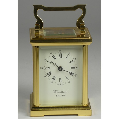 213 - A brass carriage clock, the enamel dial signed Woodford, Est 1860, Roman numerals, the movement sign... 