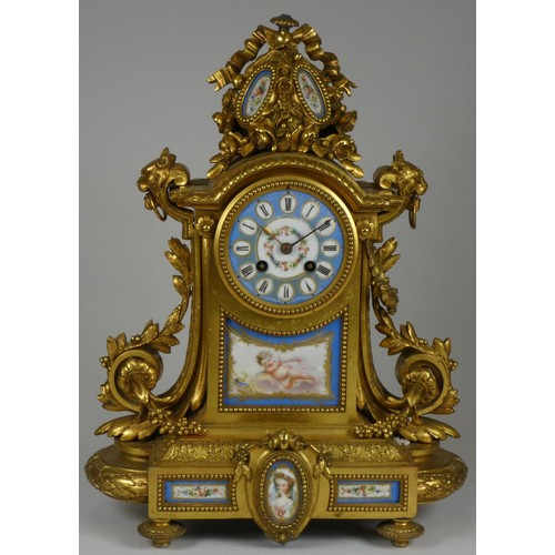 217 - A 19th century French ormolu and porcelain mantel clock garniture, mounted with Sevres style panels ... 