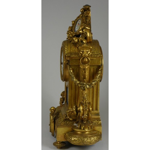 217 - A 19th century French ormolu and porcelain mantel clock garniture, mounted with Sevres style panels ... 