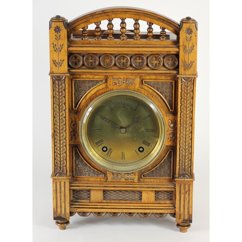 228 - An Arts and Crafts mantle clock, brass dial with Roman numerals, the case with carved decoration, th... 