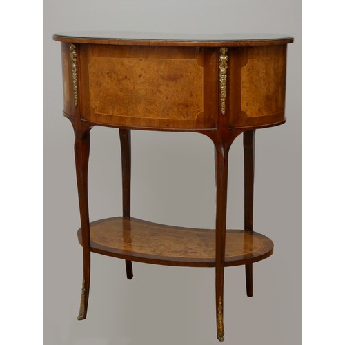 256 - A French kidney shape burr walnut and mahogany side table, with beaded edge, glass protector, over t... 