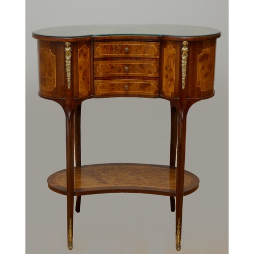 256 - A French kidney shape burr walnut and mahogany side table, with beaded edge, glass protector, over t... 