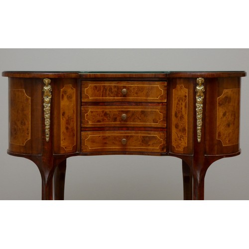 256 - A French kidney shape burr walnut and mahogany side table, with beaded edge, glass protector, over t... 