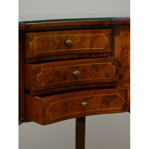 256 - A French kidney shape burr walnut and mahogany side table, with beaded edge, glass protector, over t... 