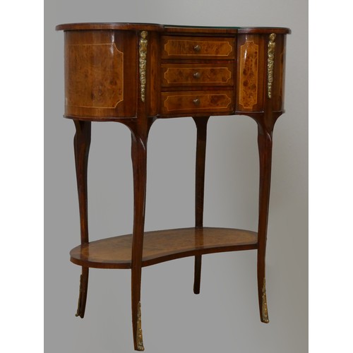 256 - A French kidney shape burr walnut and mahogany side table, with beaded edge, glass protector, over t... 