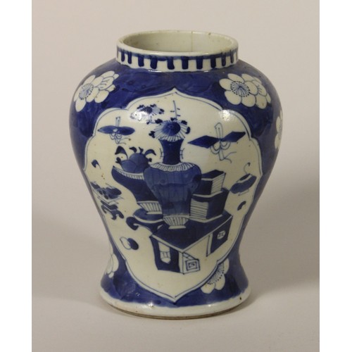 203 - A Kang Si earthenware blue and white baluster vase, 4 character mark, decorated with two panels of v... 