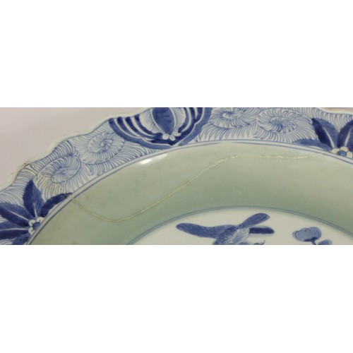 199 - A Kang Si blue and white charger, with central bird and foliage design, floral wavy boarder, charact... 