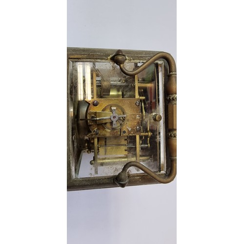 210 - A French 19th century brass alarm and repeating carriage clock, by Japy Freres, Paris, the white ena... 