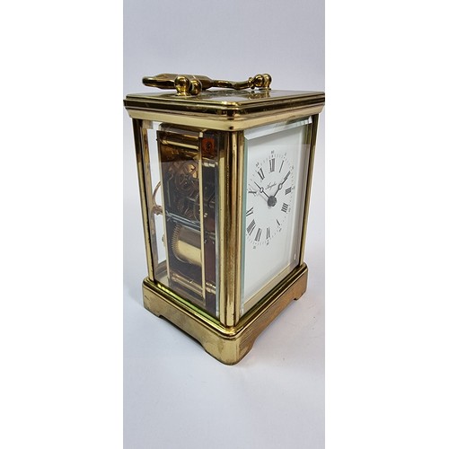 211 - An Angelus 8 day striking carriage clock, the white enamel dial with roman numerals, the movement st... 