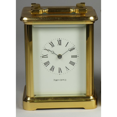 212 - A brass carriage clock, the white enamel dial signed Mappin and Webb Ltd, Roman numerals, the 11 jew... 