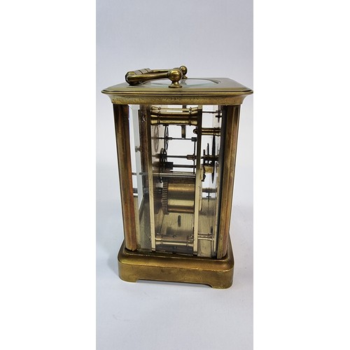 235 - A brass carriage clock, the white enamel dial with Roman numerals, the movement numbered 98, 13 x 10... 