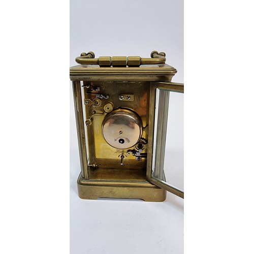 237 - A French 19th century alarm carriage clock, the white enamel dial with subsidiary alarm dial, the mo... 