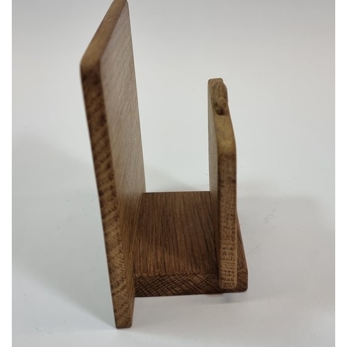 168 - Peter Rabbitman Heap, an oak letter rack, with carved rabbit motif, 13 x 13cm.