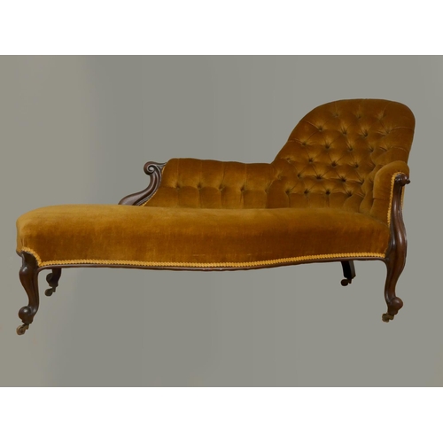 243 - A Victorian mahogany chaise longue, with serpentine front, raised on cabriole legs with brass caster... 