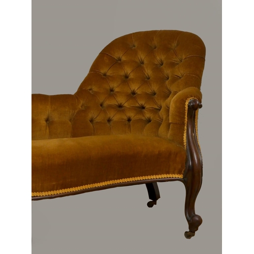 243 - A Victorian mahogany chaise longue, with serpentine front, raised on cabriole legs with brass caster... 