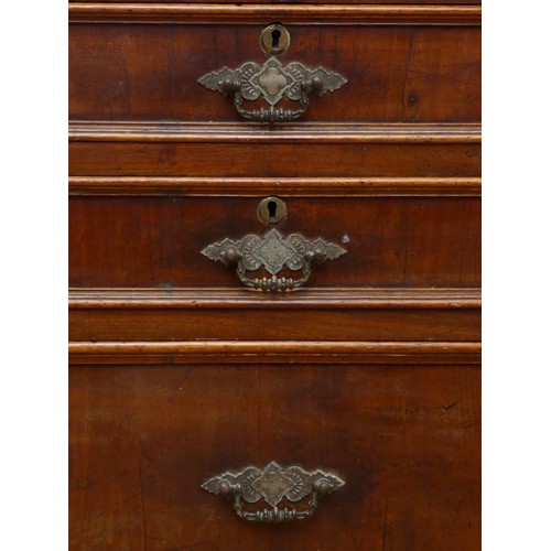 260 - A Georgian mahogany campaign chest of drawers, in two sections, the top with four short drawers over... 