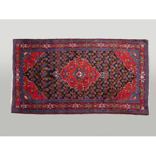 262 - WITHDRAWN - A Persian rug, with red and dark blue field, 245 x 125cm