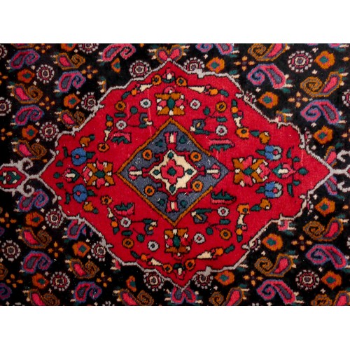 262 - WITHDRAWN - A Persian rug, with red and dark blue field, 245 x 125cm