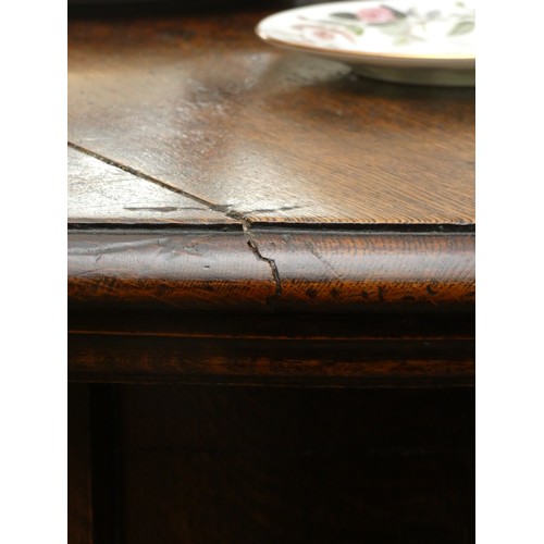 247 - A late 19th century oak wind out dining table with three leaves, together with a set of eight matchi... 