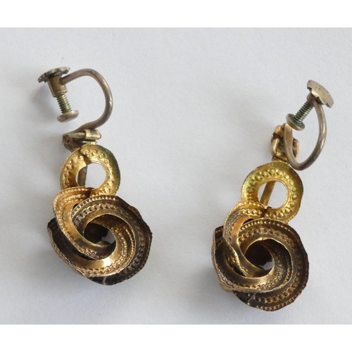 72 - A Victorian pair of gold and garnet floral scroll ear rings, later screw fittings, 30mm, 3.8gm