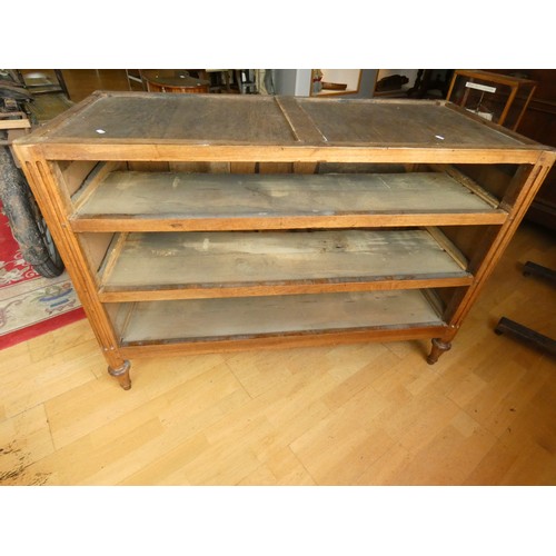 258 - A French walnut chest of three drawers, flanked by fluted columns, raised on tapering feet, grey mar... 