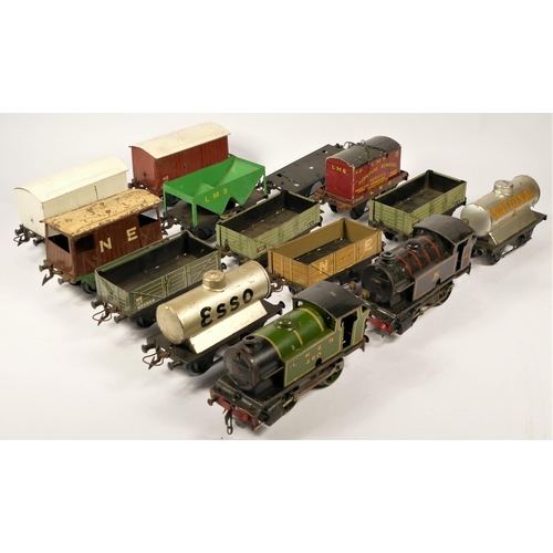 7 - Two suitcases of 'O' gauge clockwork model railway items, to include track, engines, wagons, coaches... 