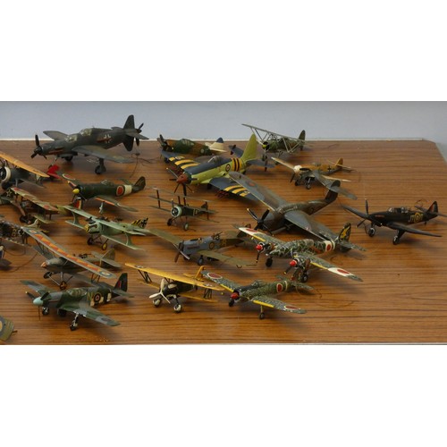 102 - A collection of model aircraft, pre and post war aircraft from the German, Japanese and Allied force... 