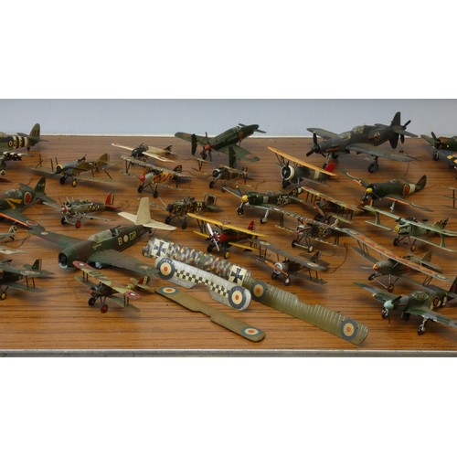 102 - A collection of model aircraft, pre and post war aircraft from the German, Japanese and Allied force... 