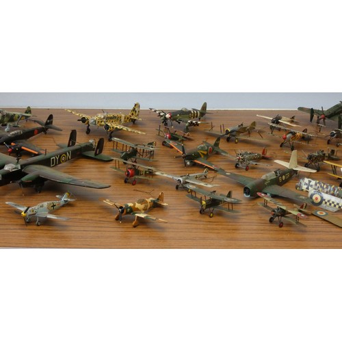 102 - A collection of model aircraft, pre and post war aircraft from the German, Japanese and Allied force... 