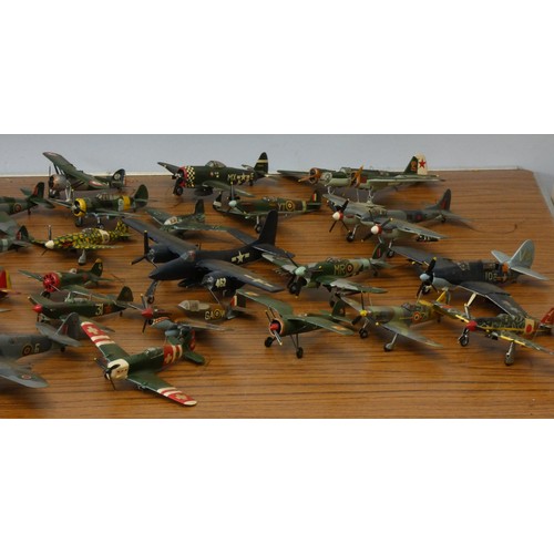 103 - A collection of model aircraft, pre and post war aircraft from the German, Japanese and Allied force... 