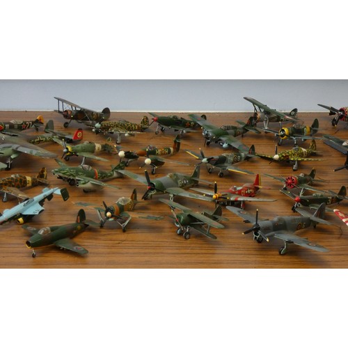 103 - A collection of model aircraft, pre and post war aircraft from the German, Japanese and Allied force... 