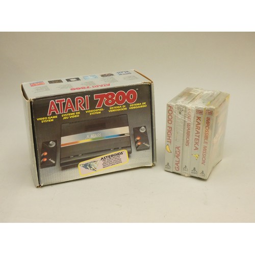 8 - A boxed Atari 7800 serial number X-9383816783, together with power supply unit, mini stick controlle...