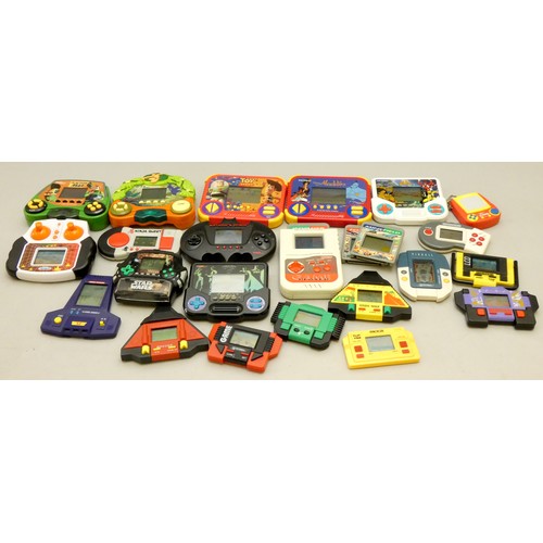 17 - A collection of handheld electronic games to include, Disney's Tarzan, Aladdin, Toystory, Batman For...