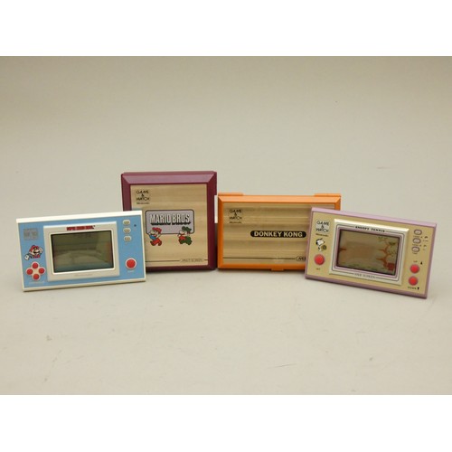 22 - A collection of Nintendo Games and watch handheld games to include, Donkey Kong, Mario Bros., Super ... 