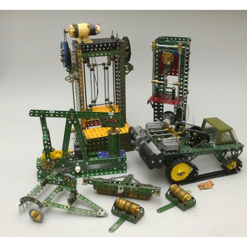 58 - A collection of Meccano display models to include motorised industrial presses, a pump and a motoris... 