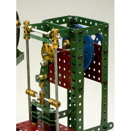 58 - A collection of Meccano display models to include motorised industrial presses, a pump and a motoris... 