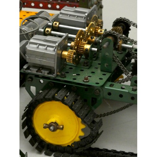 58 - A collection of Meccano display models to include motorised industrial presses, a pump and a motoris... 