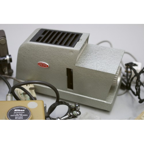 181 - A collection of slide and 8mm projectors, including a Gnome Alphax IV slide projector, along with ot... 