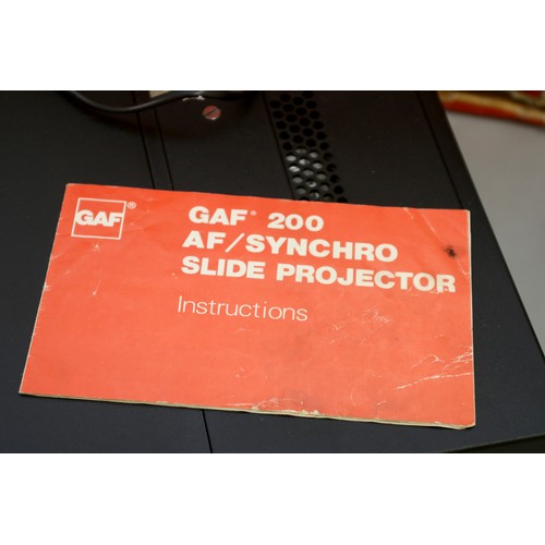 184 - A GAF 200 AF/Synchro Slide projector, with box and manuel, together with a Specto Ltd Type C movie p... 