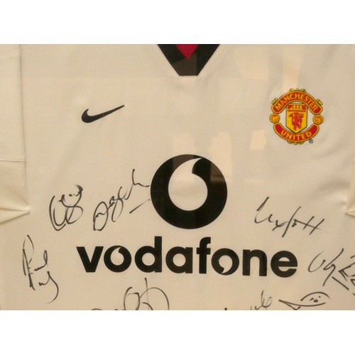 85 - A Manchester United signed replica shirt, the shirt is the away kit from the 2002-2003 season in whi... 