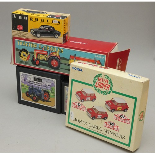 217 - A Schyling tinplate windup tractor & trailer (boxed) together with a Corgi model boxed set Mini Coop... 