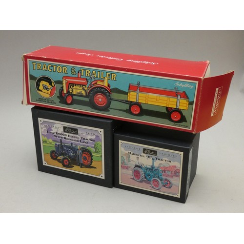 217 - A Schyling tinplate windup tractor & trailer (boxed) together with a Corgi model boxed set Mini Coop... 