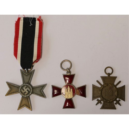 269 - Three German WWI and WWII medals, Merit Cross, Hanseatic Cross and Hindenburg Cross